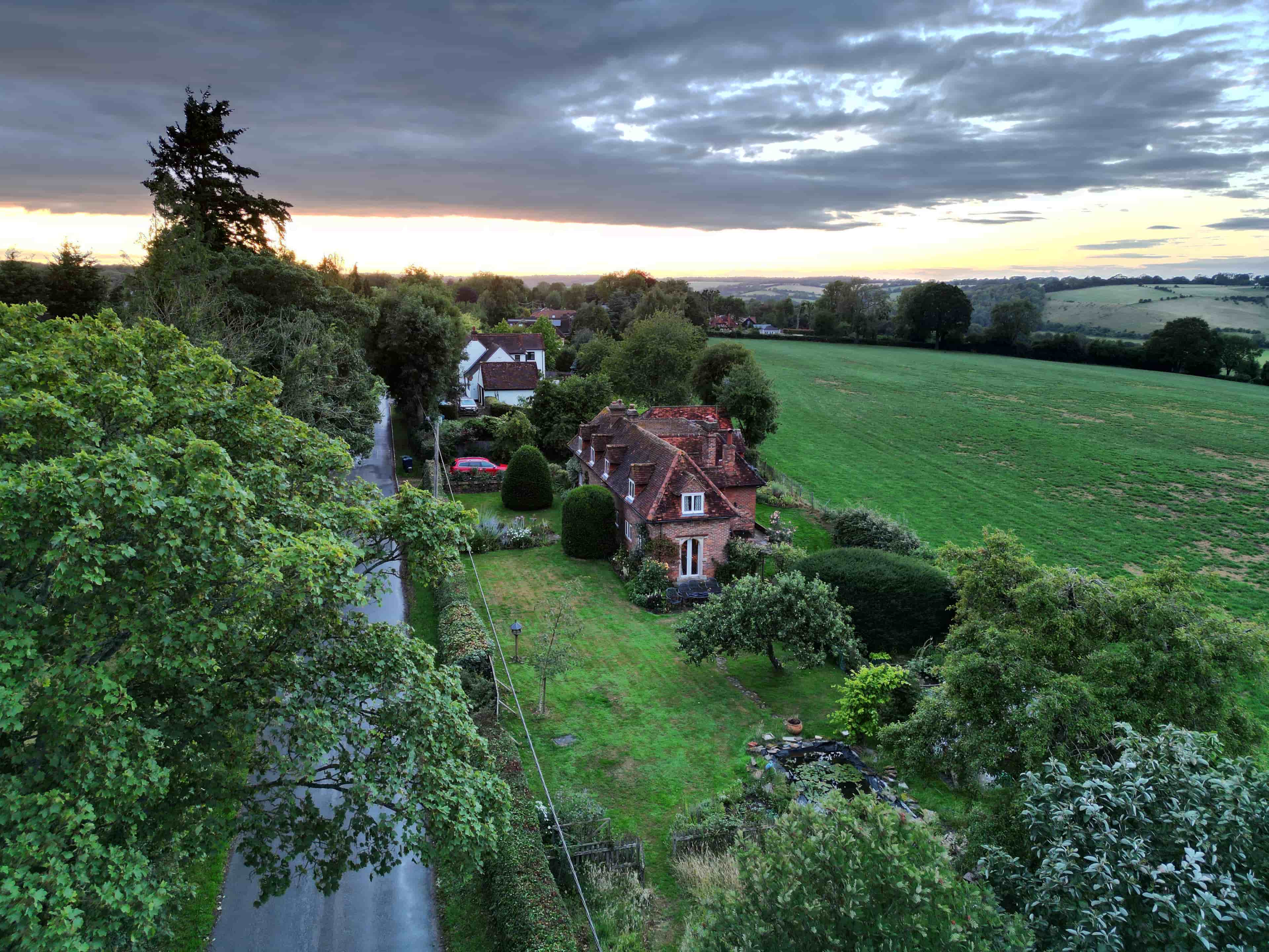 A sunset shot of a redbrick property in Radnage, UK